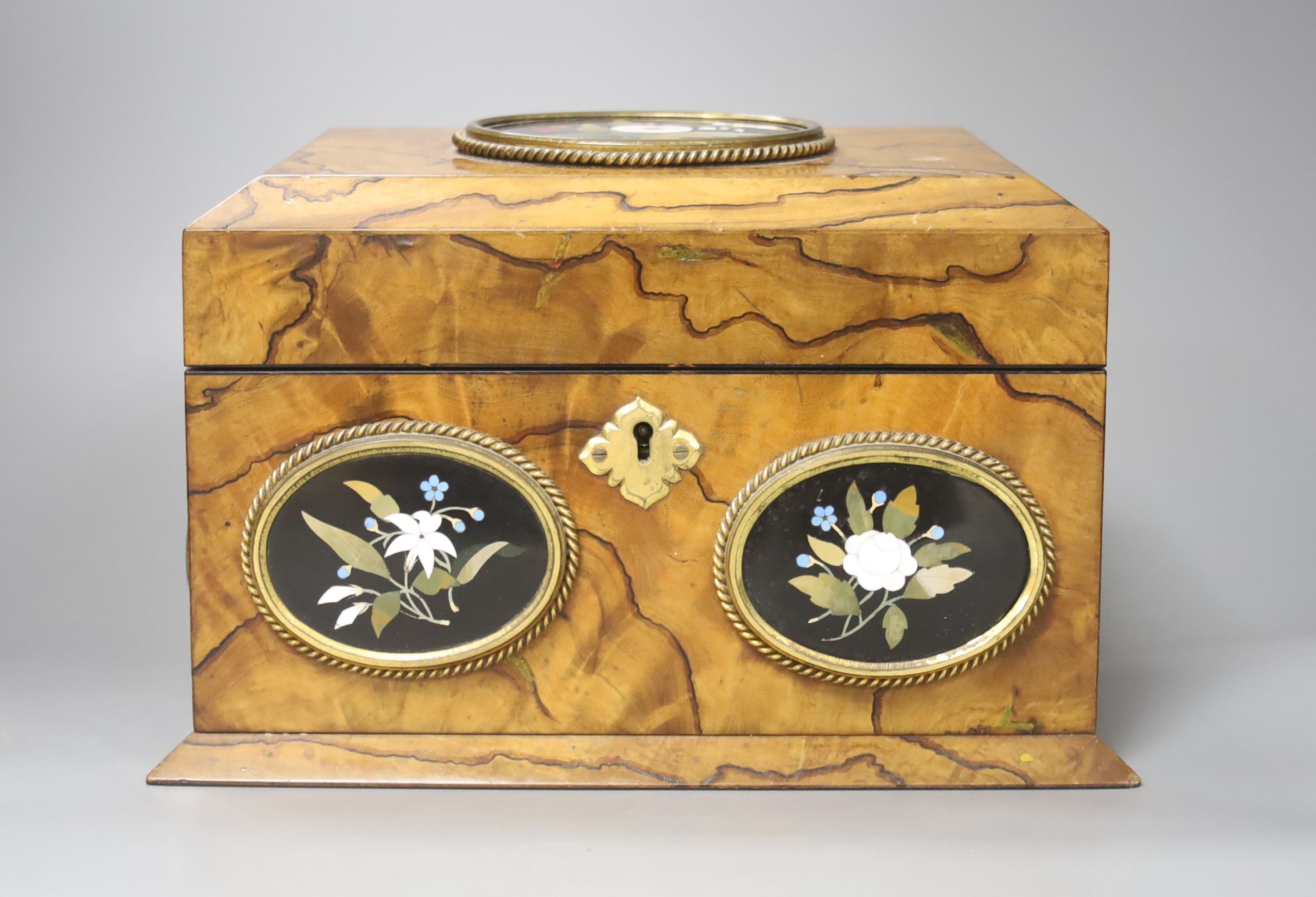 A Victorian olive wood and Ashford pietra dura mounted stationary box, retailed by Payne & Son, Lowndes St and original figuring, 24cm